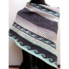 Striped shawl with representations of ocean waves in some stripes.