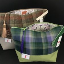 Two bags in plaid and plain fabric, with a printed lining and zip top.