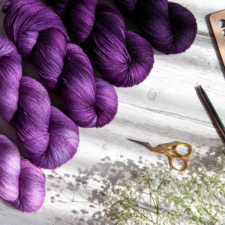 Deepest cool purple to a gentle lavender, across five skeins.