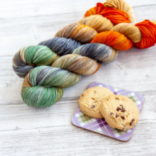 Bright, variegated yarn next to chocolate chip cookies. They do not match.