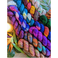 A dozen skeins of bright, variegated yarn in different colorways.