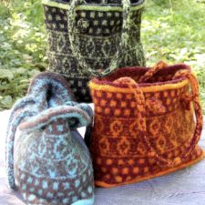 Three colorwas of the same tote bag. Intricate colorwork in horizontal panels, with I-cord handles.