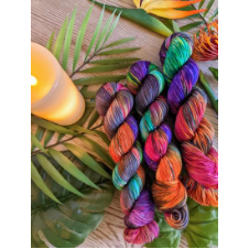 Bright, multicolor variegated yarn with a charcoal neutral color.