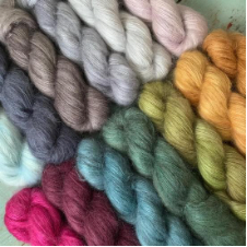 12 skeins of mohair and silk yarn in semisolid colorways.
