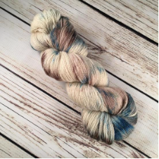 Variegated skein in the colors of driftwood washed up at the beach.