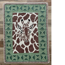 Overlay mosaic crochet blanket features giraffe head and neck. Border is inspired by African textiles.