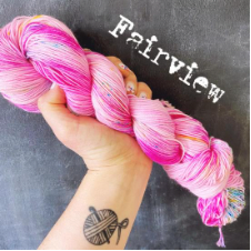 Tonal yarn in palest pink to hot pink.