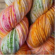 Speckled variegated yarn in the colors of home garden flowers.