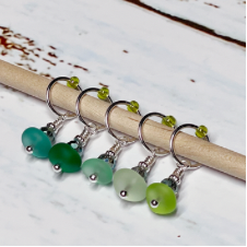 Set of five beach glass stitch markers.