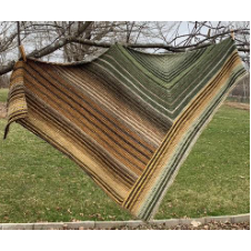 Large triangular shawl in stripes as follows. The right-hand edge has a wide striped section that goes from the top edge to the point. Just to the left of that is a mitered section. The left side of that mitered section continues all the way to the left edge of the shawl.