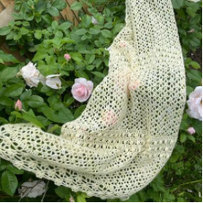 Lacey rectangular shawl with rows of textured buds.