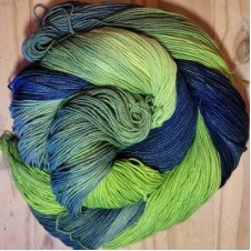 Bright and dark variegated yarn in cool tones.