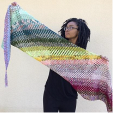 Rectangular shawl crocheted in angled stripes.