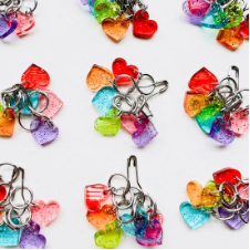 Groups of very sparkly, very tiny heart shaped stitch markers.