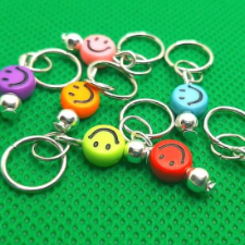 Stitch markers with smiley face charms.