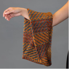 Stranded colorwork cowl in a striking geometric pattern with a Moebius twist.