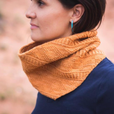 Wide cowl with geometric patterns using texture.
