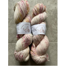 Cream yarn with deep floral speckles.