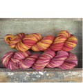 Variegated yarns in warm colors.