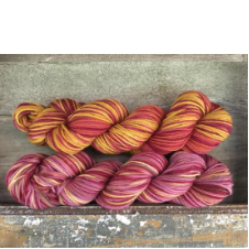 Variegated yarns in warm colors.