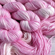 Tonal yarn in palest to medium pink.