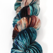 Variegated and speckled yarn in Pacific Northwest colors of the sea and deep forests.