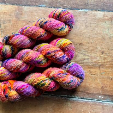 Very bright, highly variegated boucle skeins