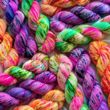 Neon-bright, variegated and speckled mini skeins.