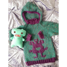 Children’s hoodie with silly monster in colorwork and contrasting hem and cuffs.