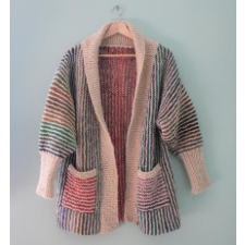 Cardigan with foldover collar, attached pockets and long cuffs. Design alternates cream and rainbow colors in thin vertical stripes. Sleeves have horizontal stripes.