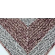 Mainly garter stitch shawl with slipped stitches to create a line down the spine and lines extending to the edges.