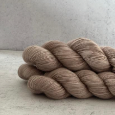 Semisolid yarn in medium warm tone.