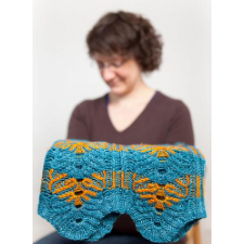 Cowl with lotus-shaped textured pattern. Some lotuses have a second color worked in.