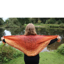 Mainly triangular shawl with lace panel down the spine.