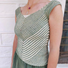 V-neck tank with stripe that also form a V down the front. Groupings alternate between close together stripes and more spread out ones.