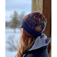 Colorwork beanie with trees, a geometric crown and the words Stay Wild.
