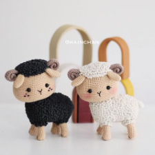 Crocheted sheep in black and cream.