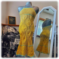 Halter dress with mermaid skirt. Texture is large wavy vertical stripes with openwork borders between.