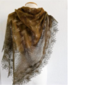 Triangular shawl with leaves, mesh and a stunning edge that looks a bit like lotus flowers.