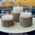 Very crisp, crocheted sleeves around glass candle holders Each sleeve has a bow made with a single strand of yarn.