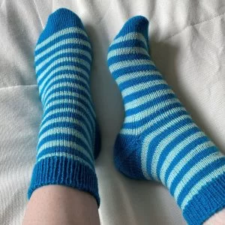 Striped socks with contrasting heels, toes and top of cuff.