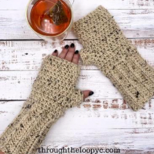 Crocheted fingerless mittens with long, ribbed cuffs.