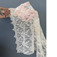 Estonian lace stole strikes a balance between nine-wrap nupps and lace.