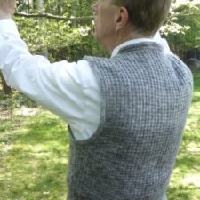 Man wearing simple, fitted vest.