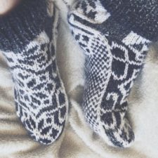 Slipper socks with elaborate colorwork pattern.