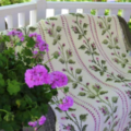 Throw blanket in Tunisian Crochet with cross-stitched columns of rose branches and buds.