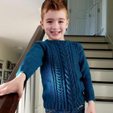 Child’s cabled pullover