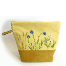 Natural-dyed project bag featuring embroidered cornflowers and other meadow plants.