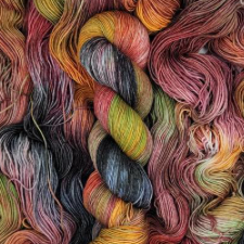 Multicolor yarn in sunset colors and black.