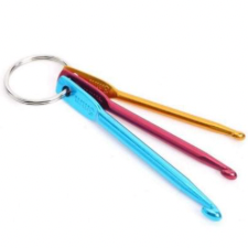 Keyring holding three small crochet hooks in different gauges.